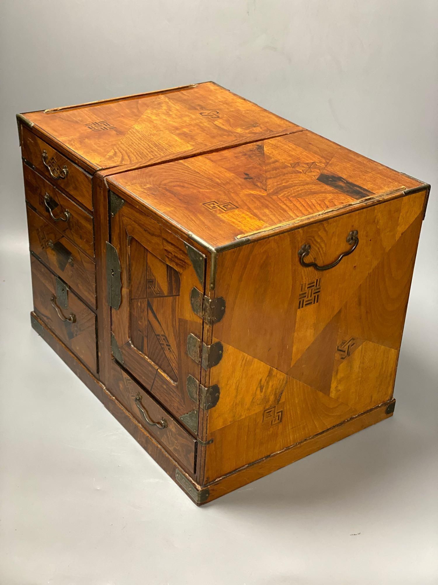 A Japanese metal mounted inlaid elm box with drawers, length 36cm